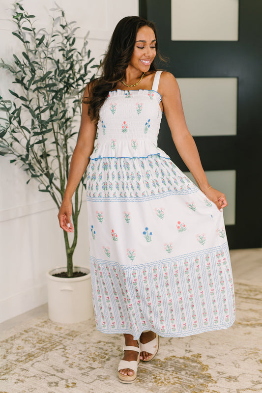 White dress with floral patterns 
Poplin Woven
Smocked Elastic Bodice
Ruffle Details
Functional Side Pocket
3/4 Lined
100% Polyester
True to Size