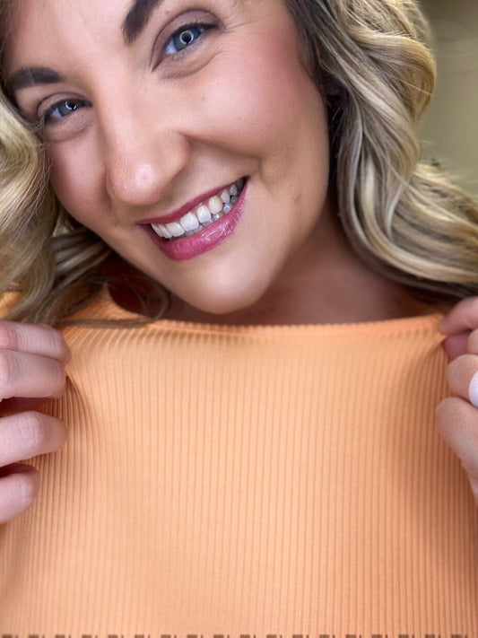 Ribbed Jersey Knit Top
Stretchy
Dolman Sleeves
Twist Back Detail
Relaxed Silhouette
 Polyester 5% Spandex
True to Size