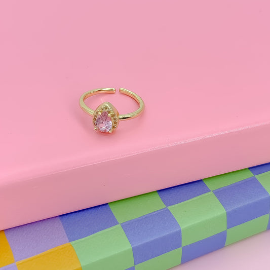 Gold ring with a pink gemstone