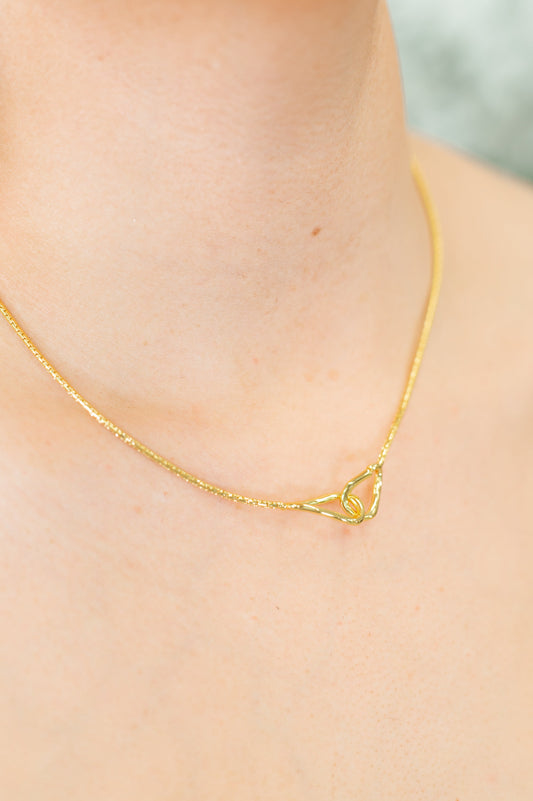 Gold plated necklace
15 1/2” Chain
1 1/4” Pendant
Gold Plated
Hoop Closure