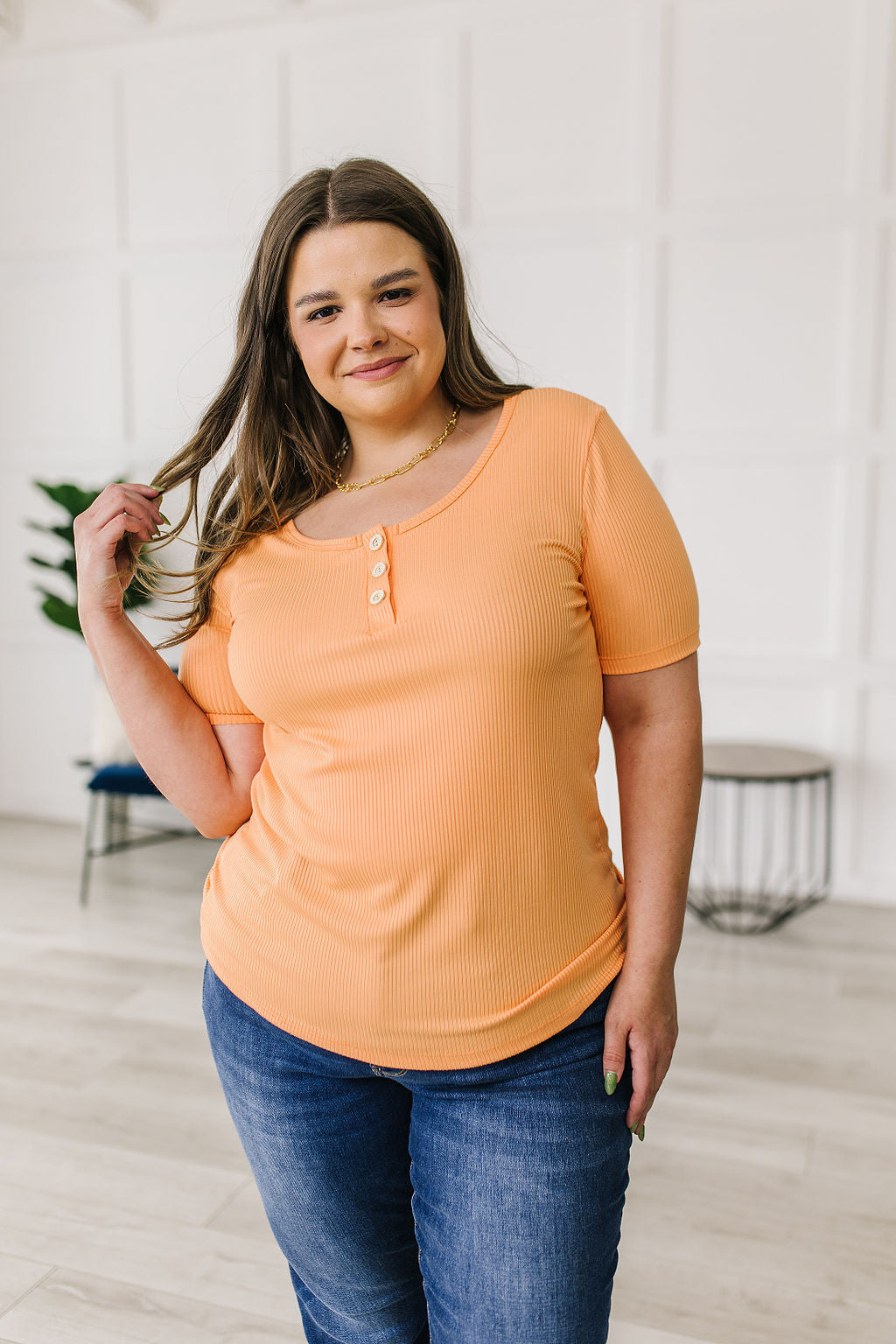 Ribbed Jersey Knit, short sleeve top in light Orange
Decorative Buttons
Scoop Neckline
Slim Fit
95% Polyester, 5% Spandex
True to Size