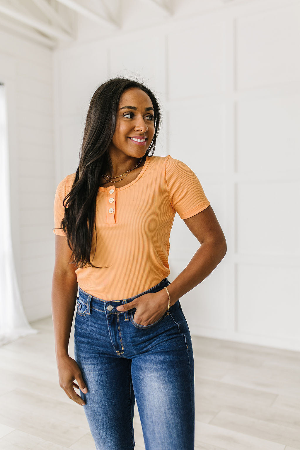 Ribbed Jersey Knit, short sleeve top in light Orange
Decorative Buttons
Scoop Neckline
Slim Fit
95% Polyester, 5% Spandex
True to Size