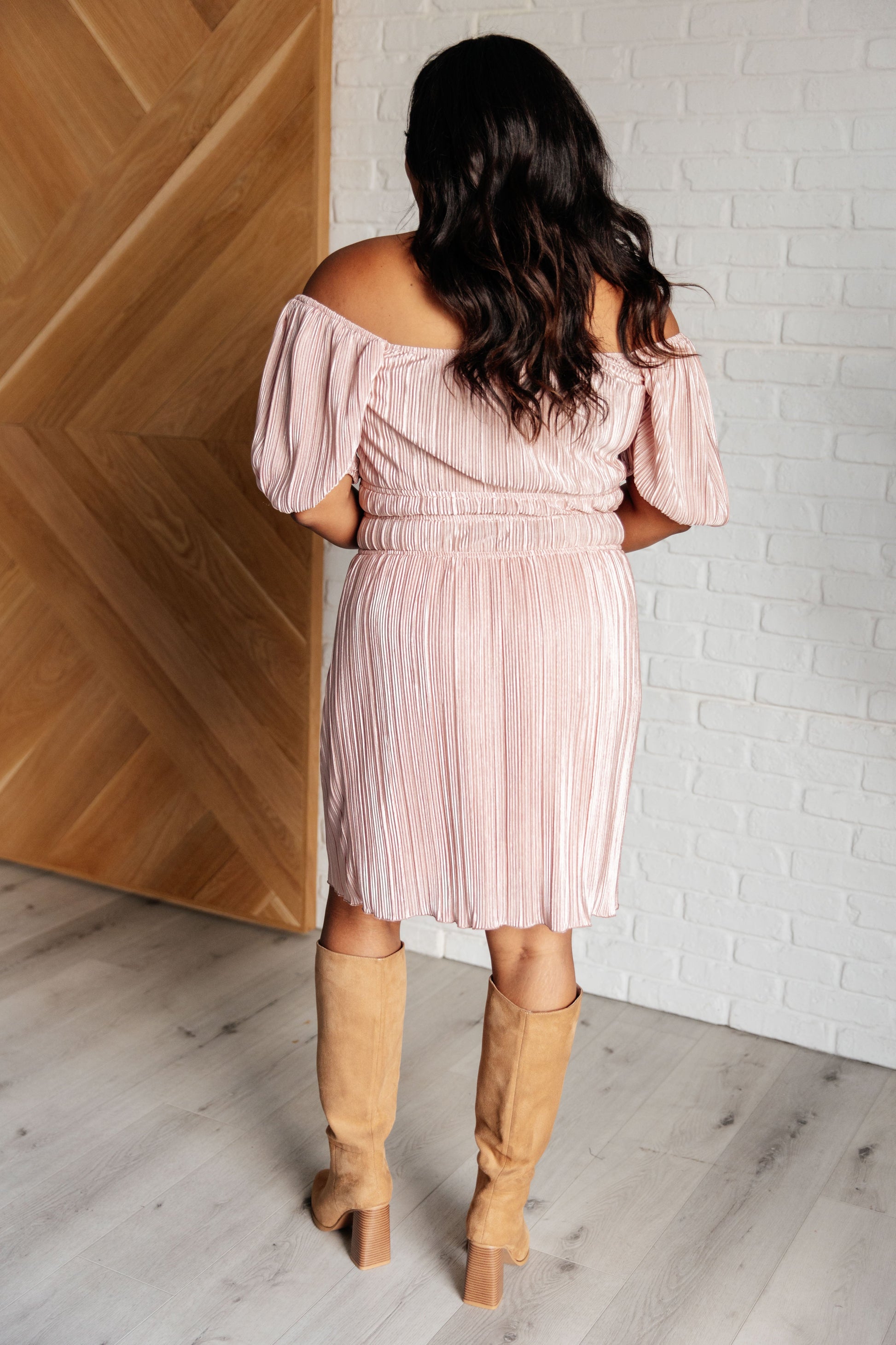Pink Poly Satin short sleeved dress
Plisse
Cased Elastic Shoulder
Scoop Neck/Off Shoulder
Balloon Sleeve
Cased Elastic Sleeve Cuff
Cased Elastic Waistline
Lined Skirt
Self and Lining: 100% Polyester
True to Size