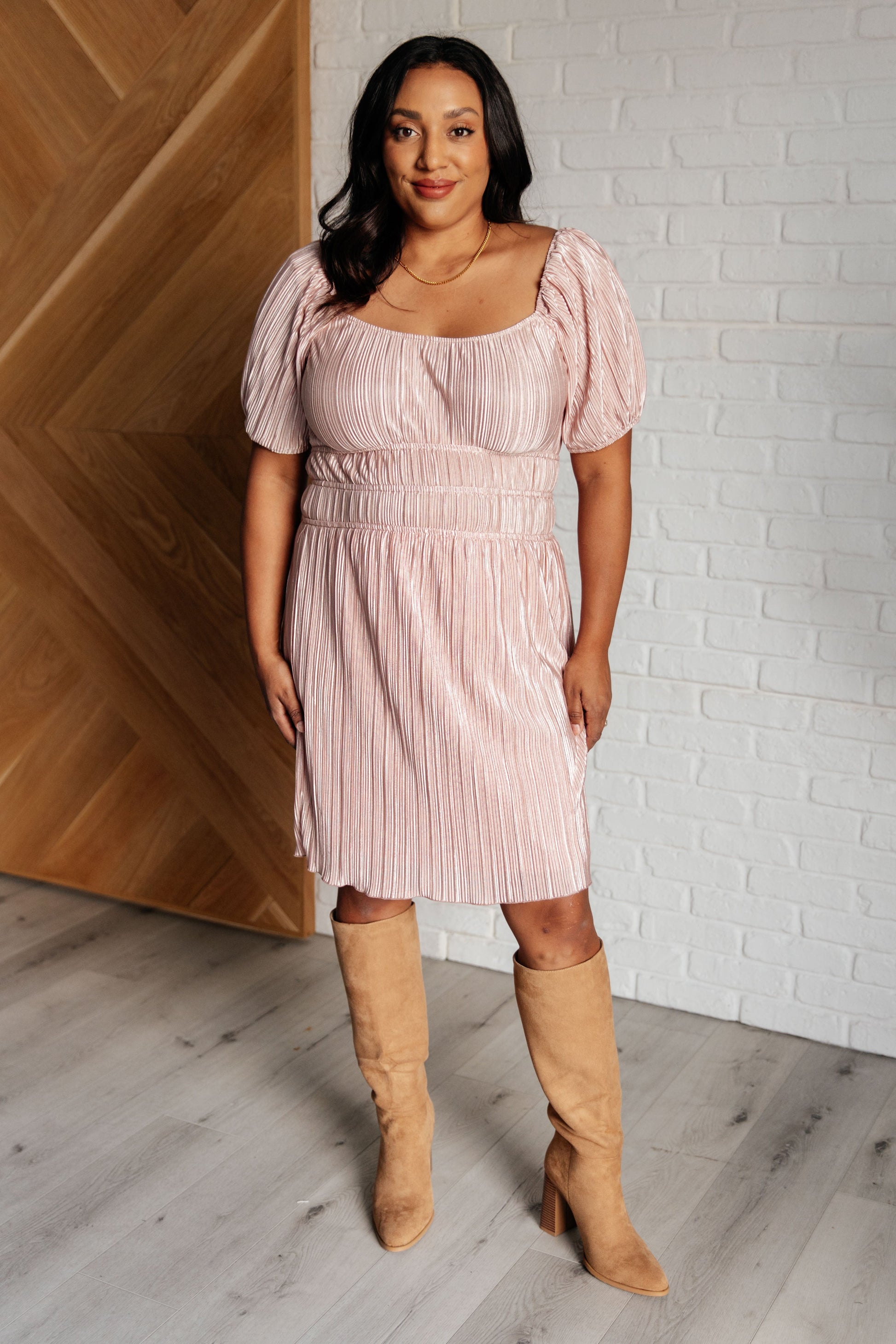 Pink Poly Satin short sleeved dress
Plisse
Cased Elastic Shoulder
Scoop Neck/Off Shoulder
Balloon Sleeve
Cased Elastic Sleeve Cuff
Cased Elastic Waistline
Lined Skirt
Self and Lining: 100% Polyester
True to Size