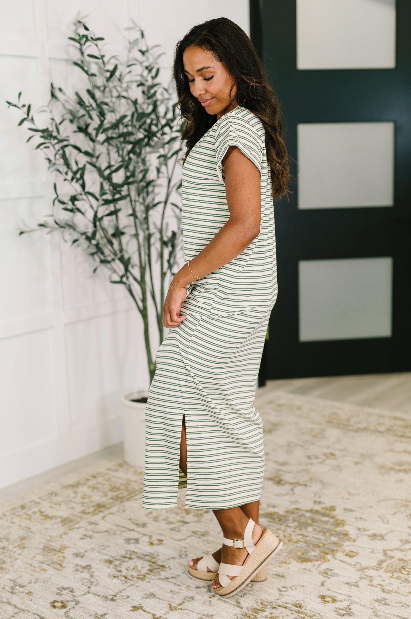 Green and white striped dress 
Ribbed Knit
High Stretch
Banded, Round Neckline
Cuffed and Tacked Sleeve
Side Slit
95% Polyester, 5% Spandex
True to Size
