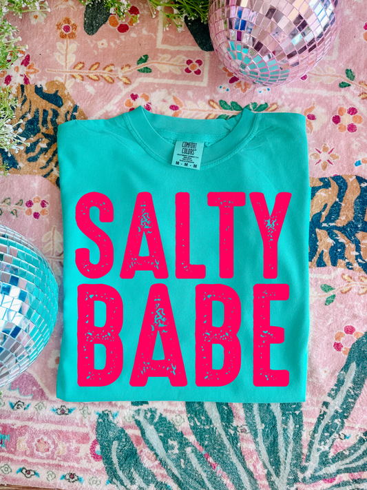 Salty Babe graphic tee
Comfort Colors 100% Cotton
Garment-dyed soft ring spun fabric
Crew Neck short sleeve unisex tee
Multicolor DTF printing on crewneck