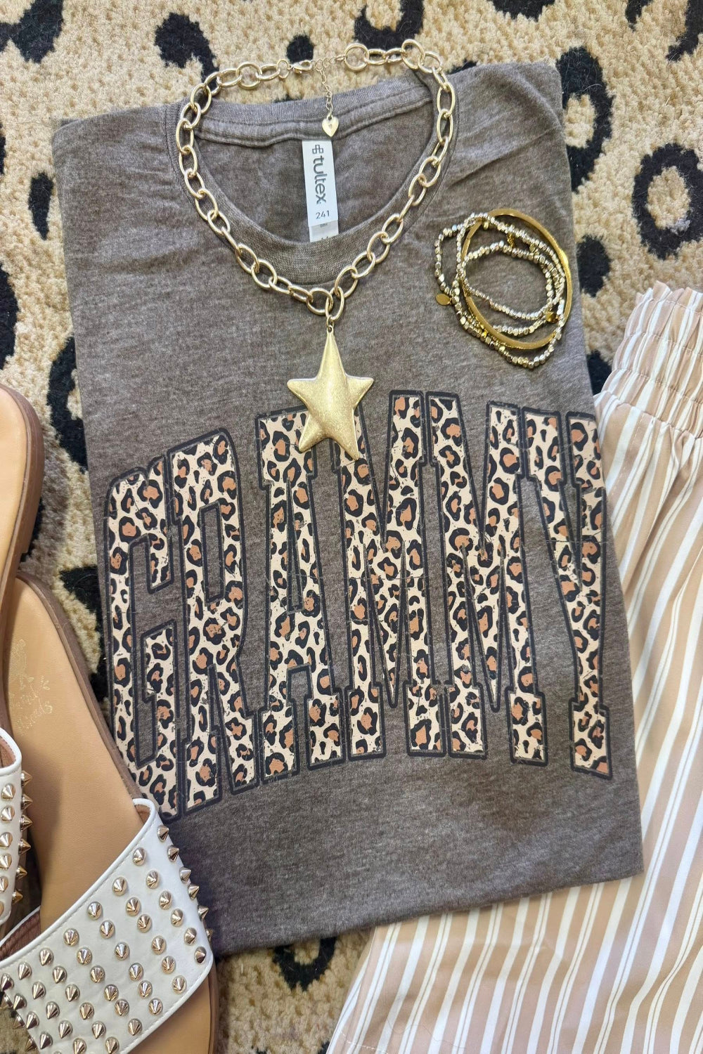 Leopard Grammy graphic tee on heather brown Tultex shirt styled with bracelets and neutral striped pants for a trendy Mother’s Day outfit.