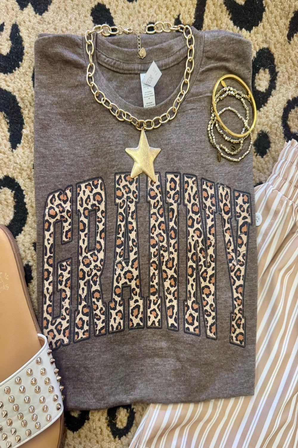 Leopard Granny graphic tee on heather brown Tultex shirt styled with bracelets and neutral striped pants for a trendy Mother’s Day outfit.