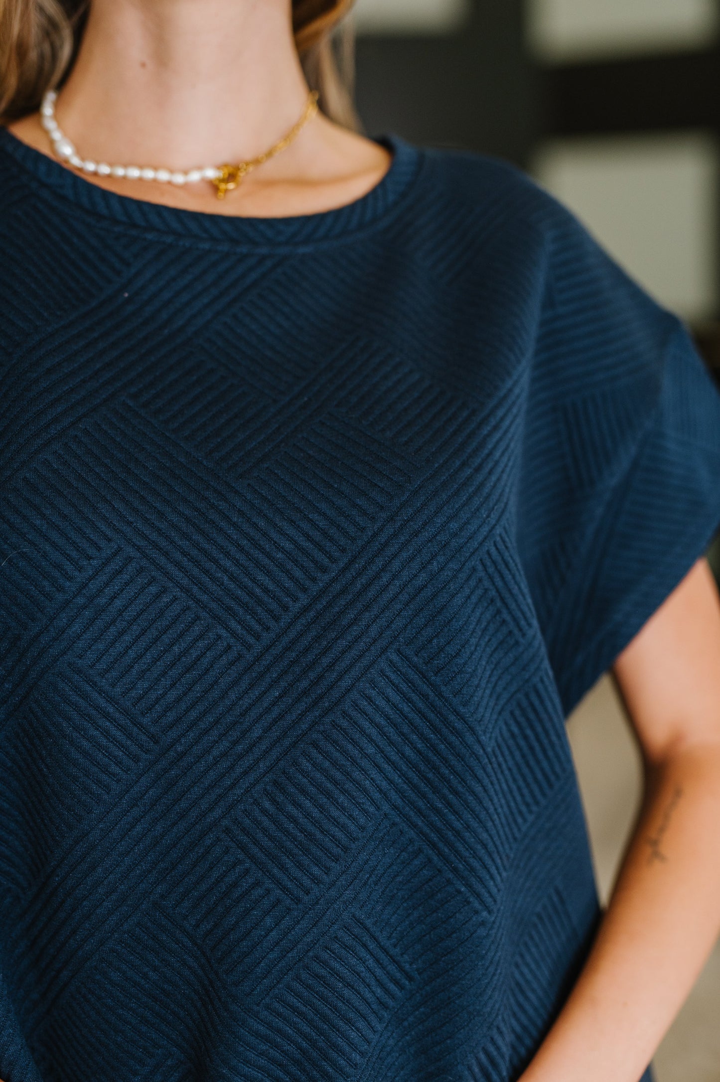 Navy Blue quilted short sleeve top by See And Be Seen. 