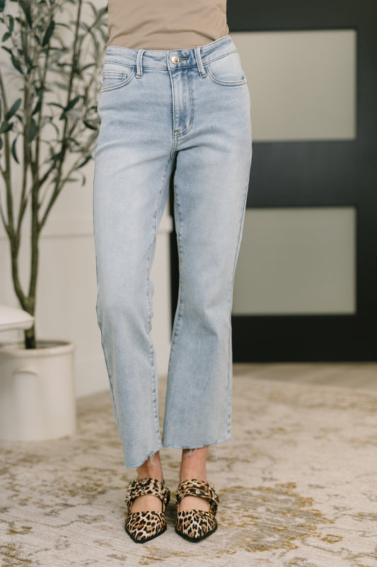 Light wash Judy Blue mid rise kick flare jeans with raw hem and stretch denim fit