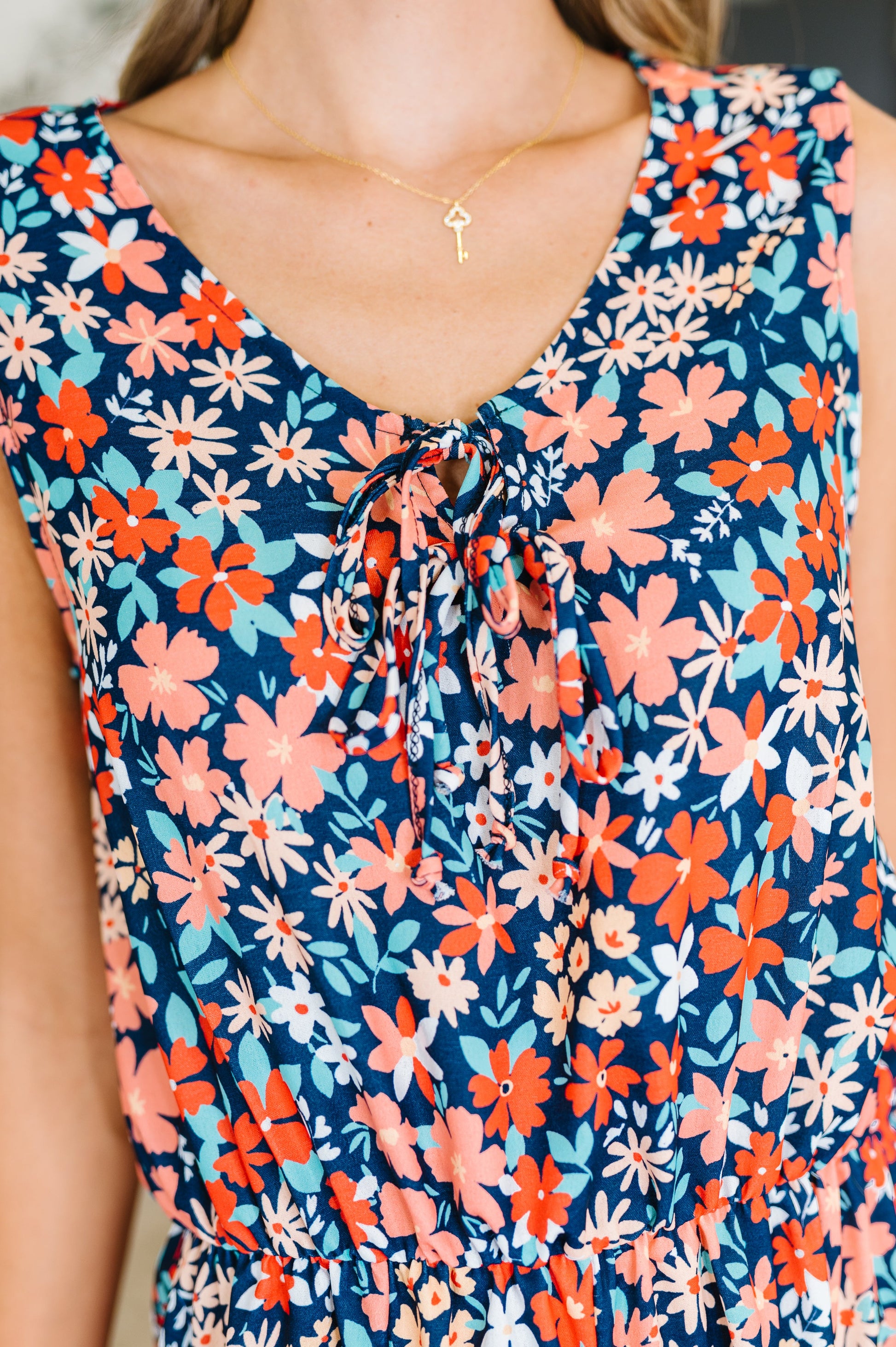 Sleeveless romper in Navy Orange and Teal
Woven
Little Stretch
Round Neckline
Functional Neck Tie
Bow Details
Sleeveless
Elastic Waistband
Godet Details
Keyhole Closure
100% Polyester
True to Size