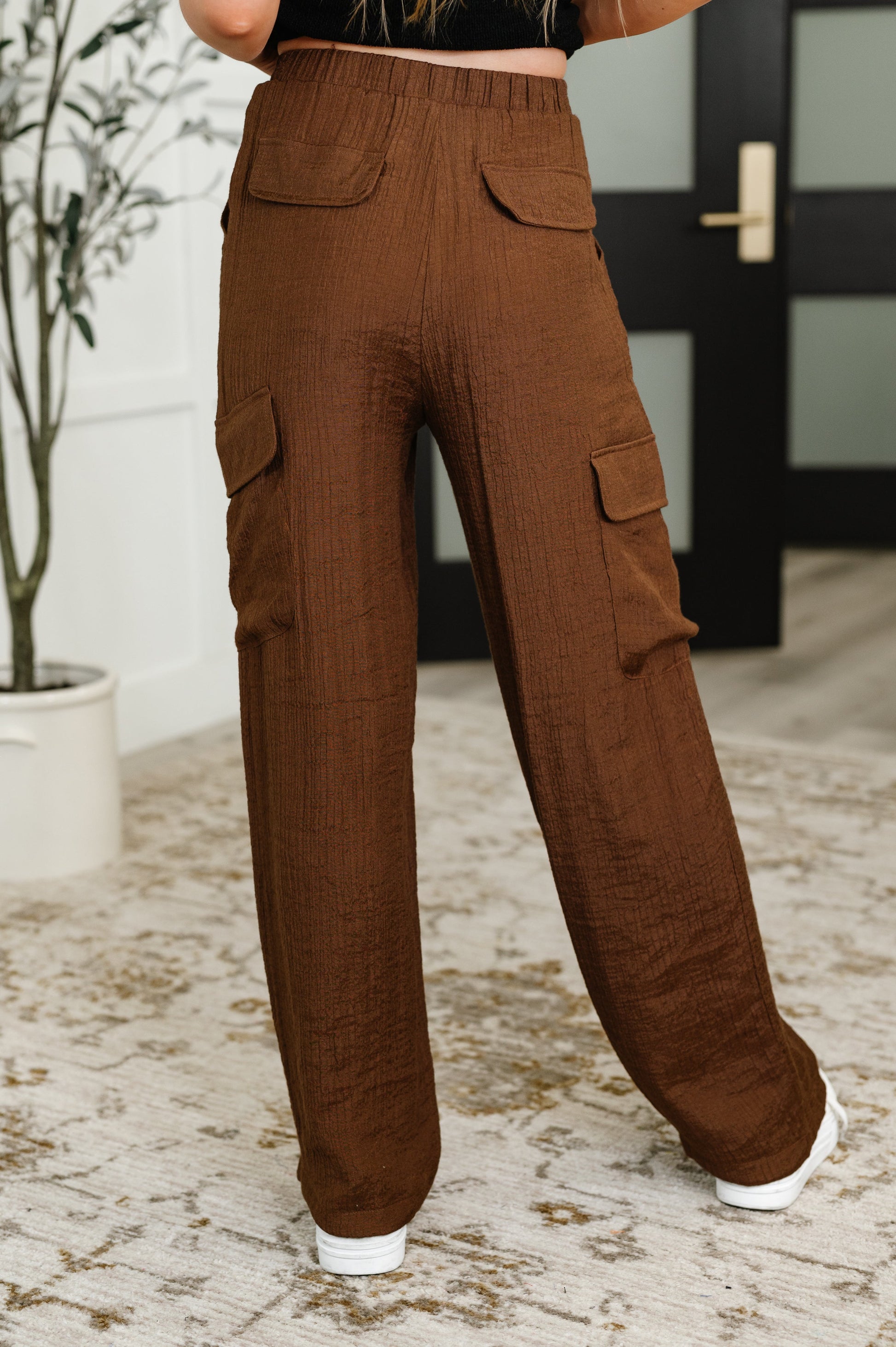 Brown cargo pants with a drawstring by Blu Pepper