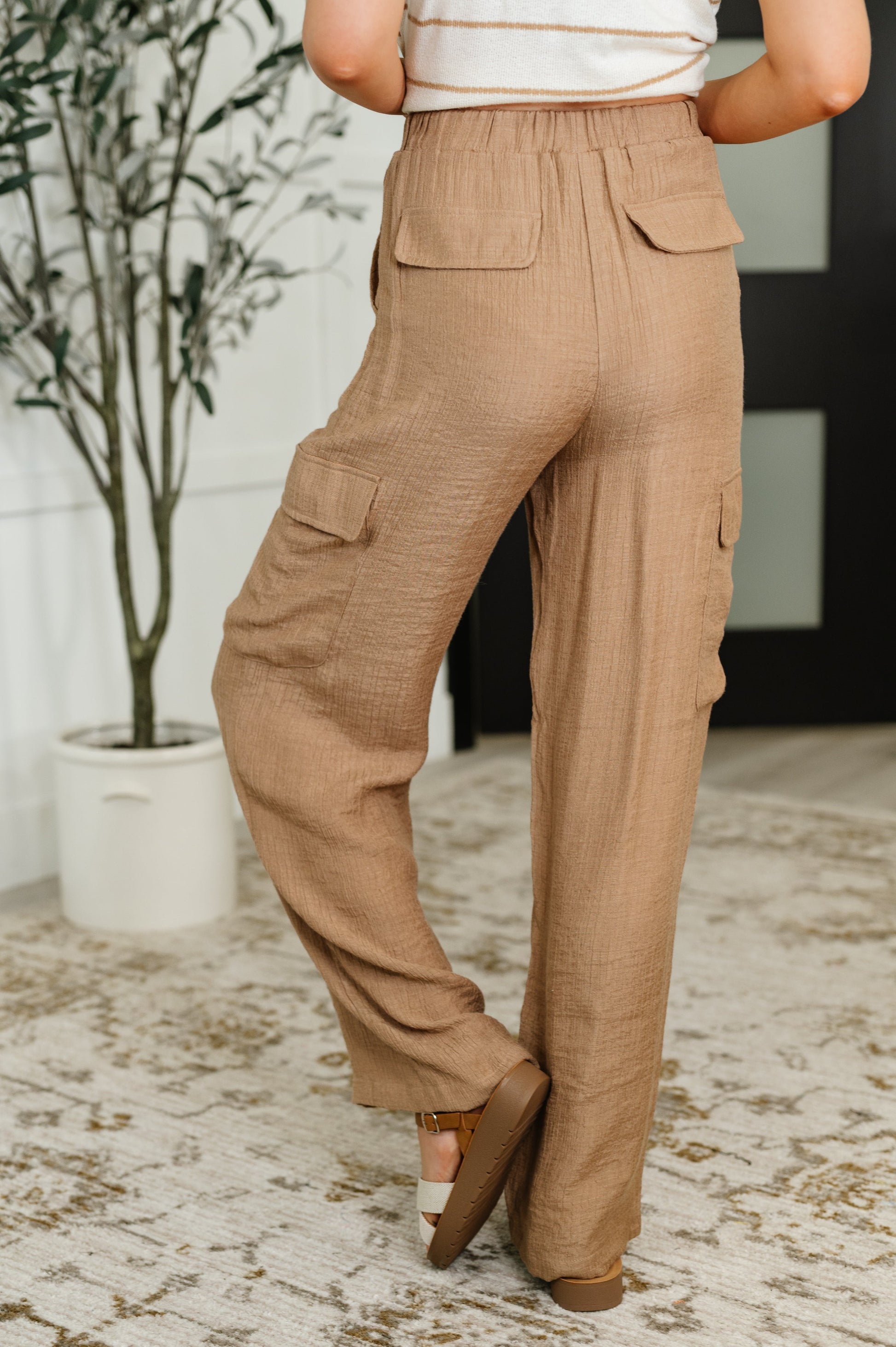 Tan cargo pants with a drawstring by Blu Pepper
