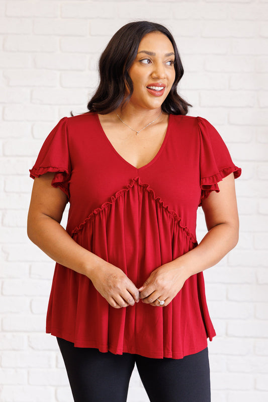 Red V Neck Short Sleeve Top
Jersey Knit
V-Neckline
Flutter Sleeve
Peplum Silhouette
Ruffle Details
65% Viscose, 30% Polyester, 5% Elastane
True to Size