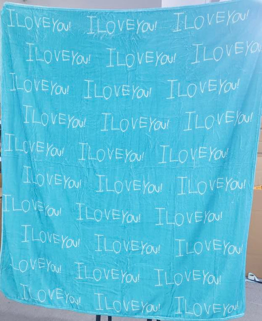 Custom handwriting blanket featuring child’s handwritten “I love you” repeated on a soft blue personalized keepsake blanket