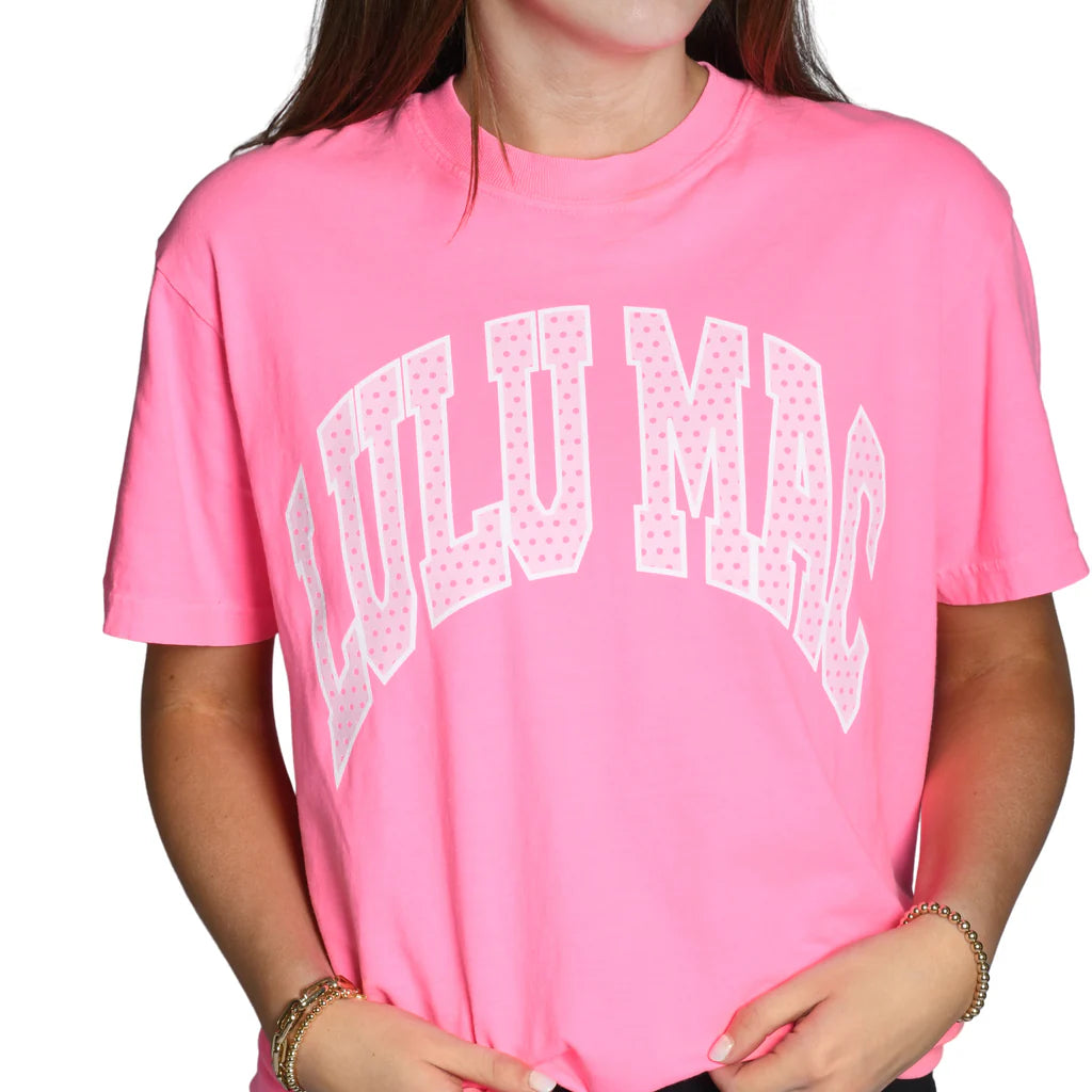 Blonde woman modeling neon pink Comfort Colors t-shirt with white polka dot Lulu Mac graphic, casual short sleeve boutique style