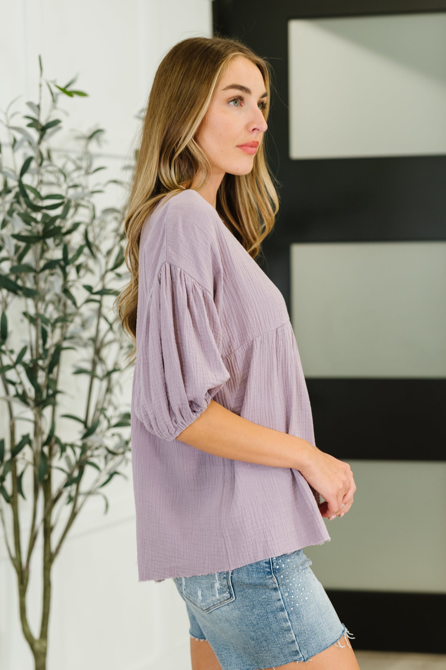 Purple peasant blouse with balloon sleeves and a V-neckline