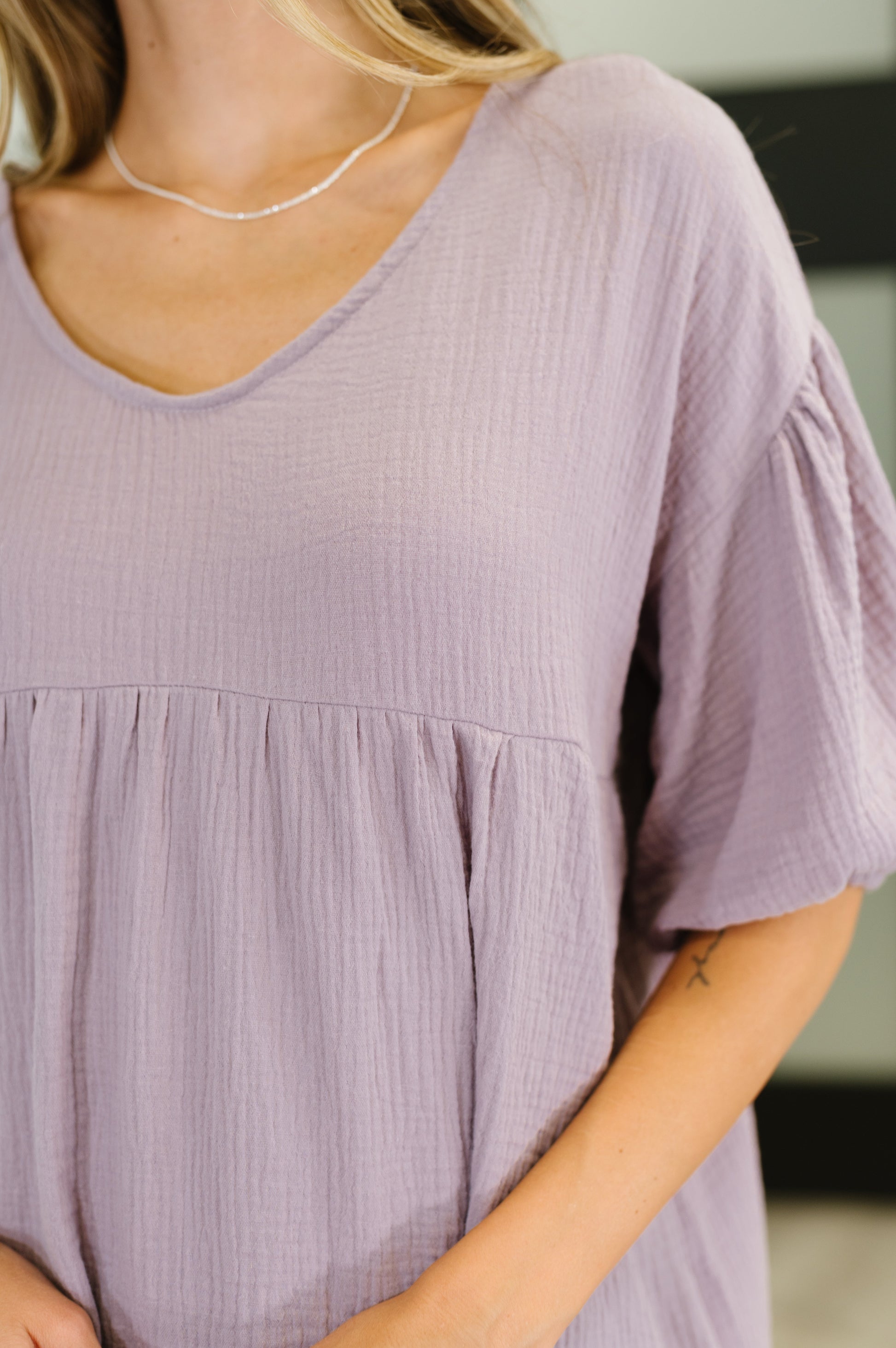 Purple peasant blouse with balloon sleeves and a V-neckline