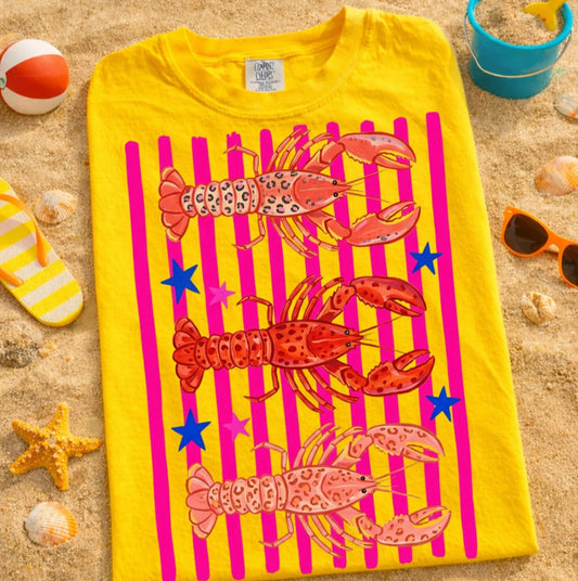 Preppy lobster graphic tee with pink stripes and blue stars on yellow shirt