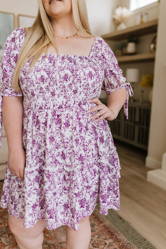 Lightweight Woven
Smocked Bodice
Elastic Neckline
Ruffled Tiered Skirt
Functional Sleeve Ties
Short Babydoll Cut
100% Polyester
True to Size floral dress by White Birch
