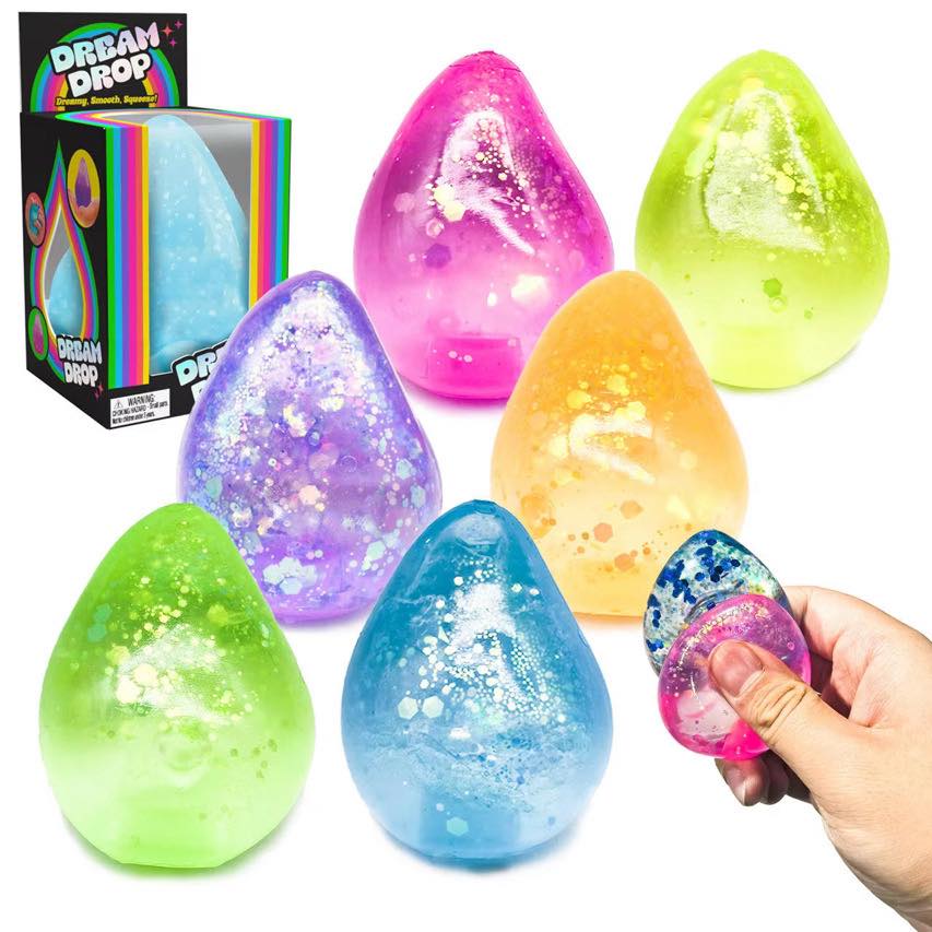 Colorful glitter dream drop squishies in assorted bright colors with slow rise texture and packaging box