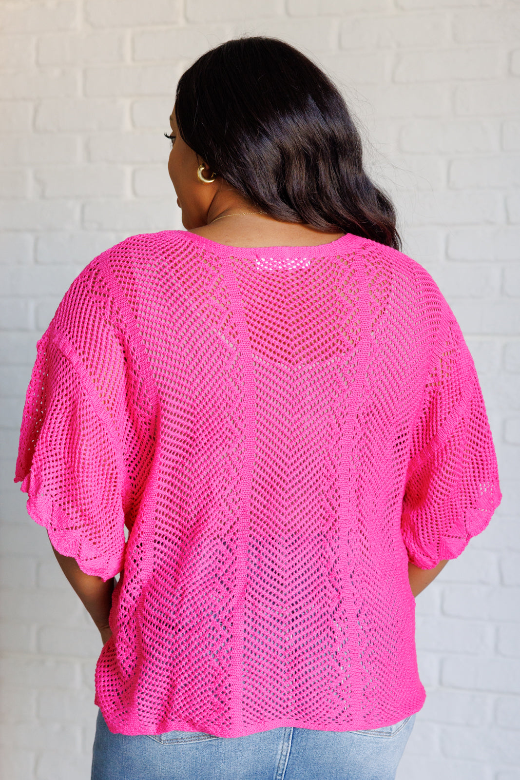 Pink open sweater knit, high stretch, drop shoulder, boat neck, scalloped sleeve cuff, boxy fit top