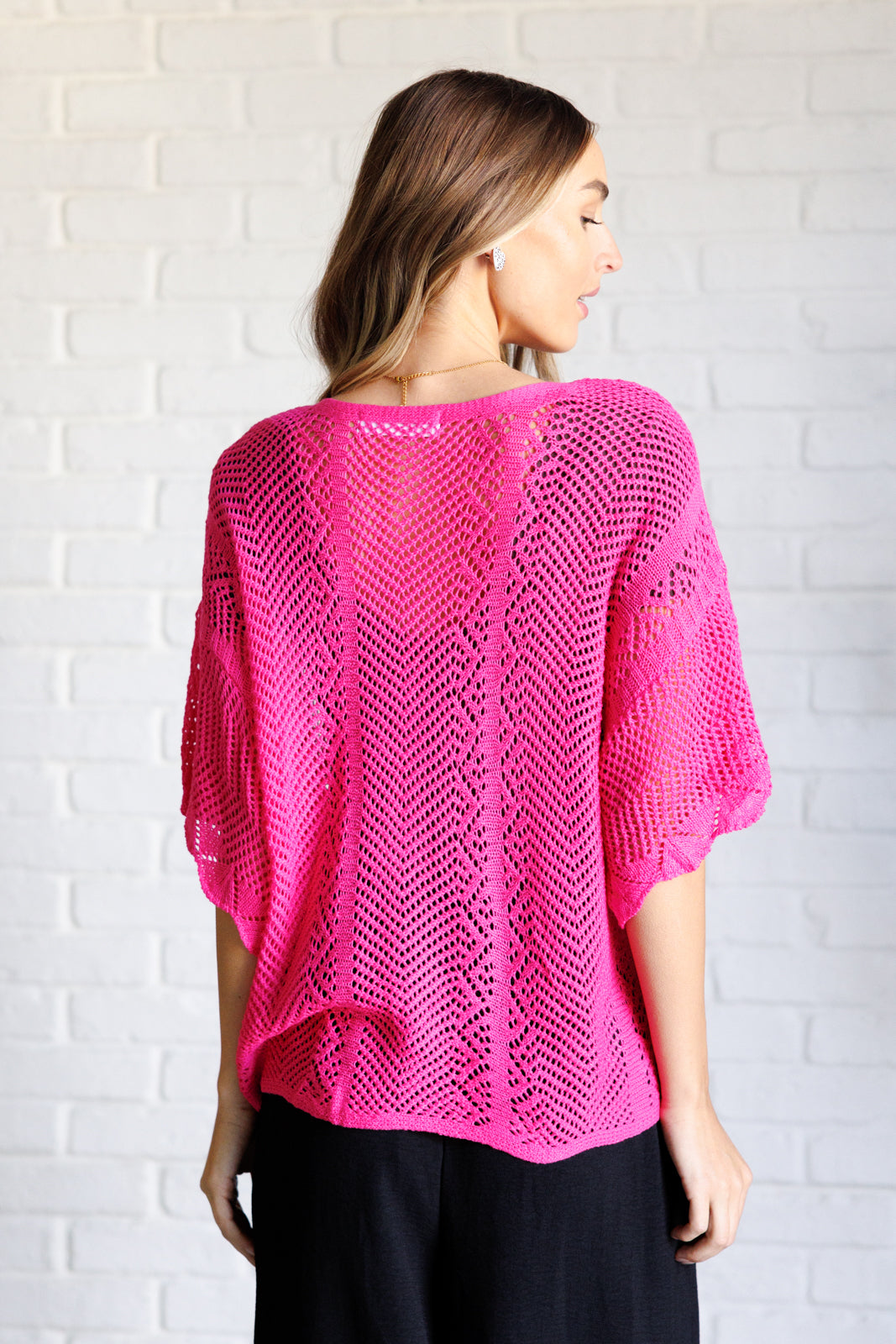Pink open sweater knit, high stretch, drop shoulder, boat neck, scalloped sleeve cuff, boxy fit top