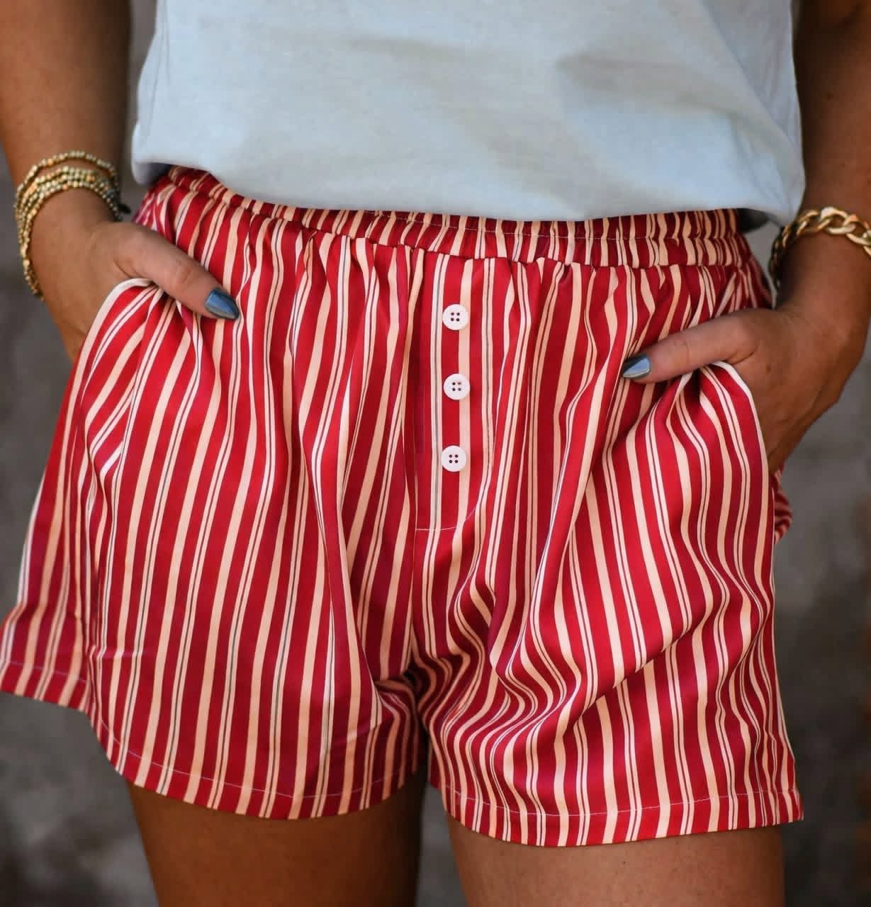 Women’s red striped button front lounge shorts with pockets and elastic waistband