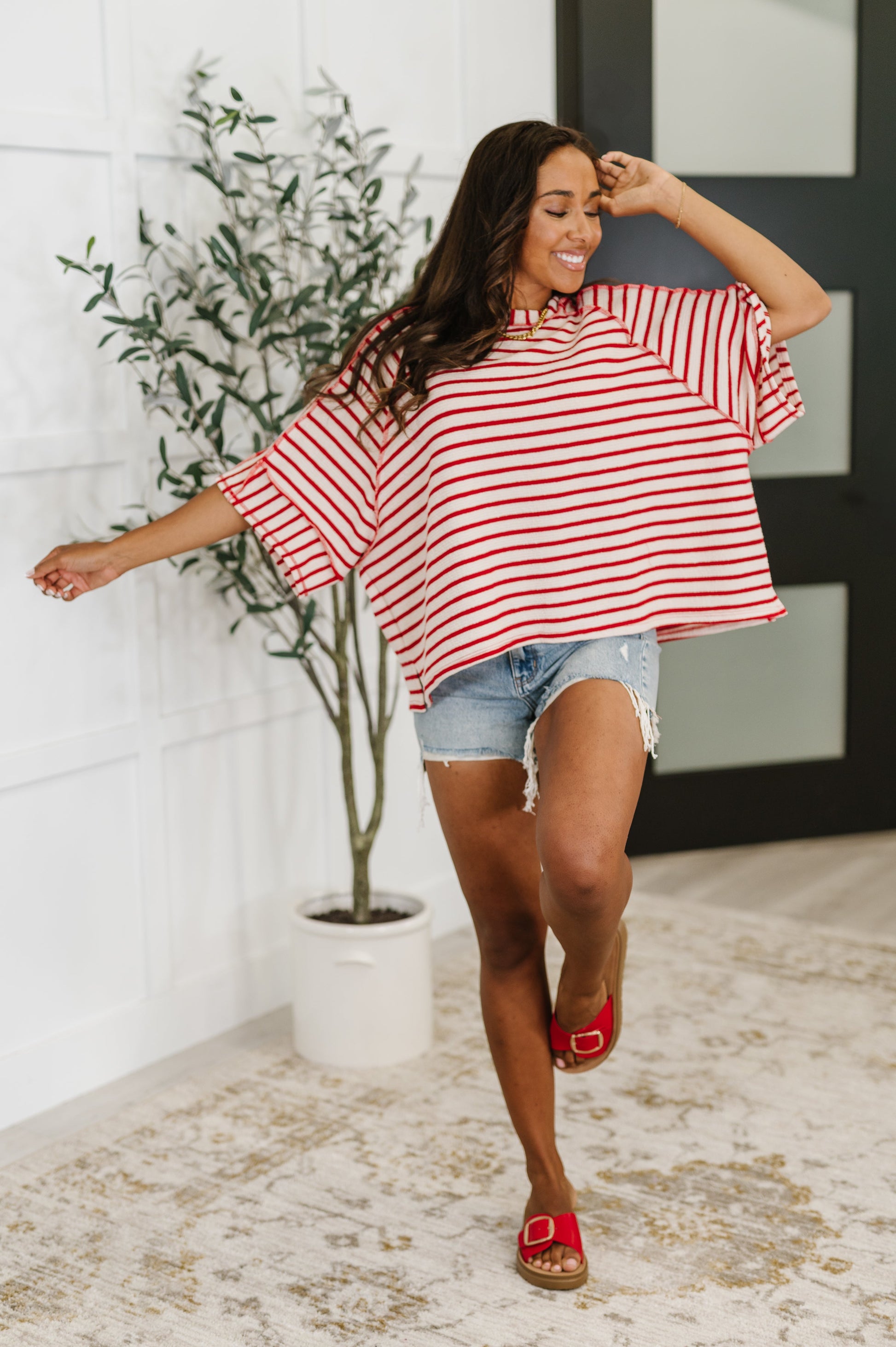  red and white striped shirt 
Textured Knit
Banded, Round Neckline
Raglan Sleeve
Exposed Seam Detail
Relaxed Fit
Small Side Slit
71% Polyester, 27% Cotton, 2% Spandex
True to Size