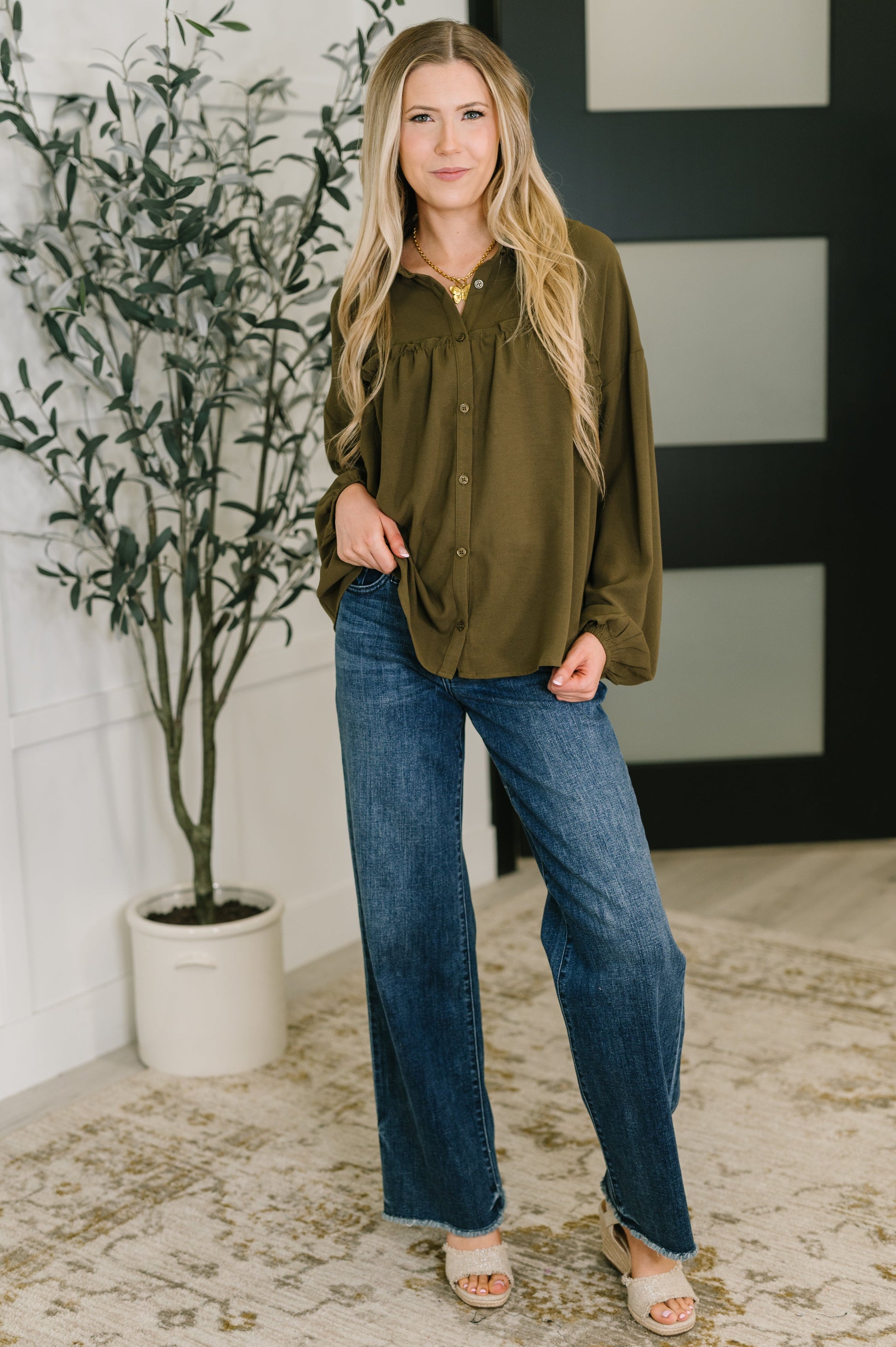 Long sleeve button down top in Olive by Andree by Unit
Woven
No-Stretch
Collared Neckline
Full Front Button Down
Cased Elastic Sleeve Cuff
Gathered, Ruffle Seam Detail
Scooped High-Low Hem
97% Polyester, 3% Spandex
True to Size