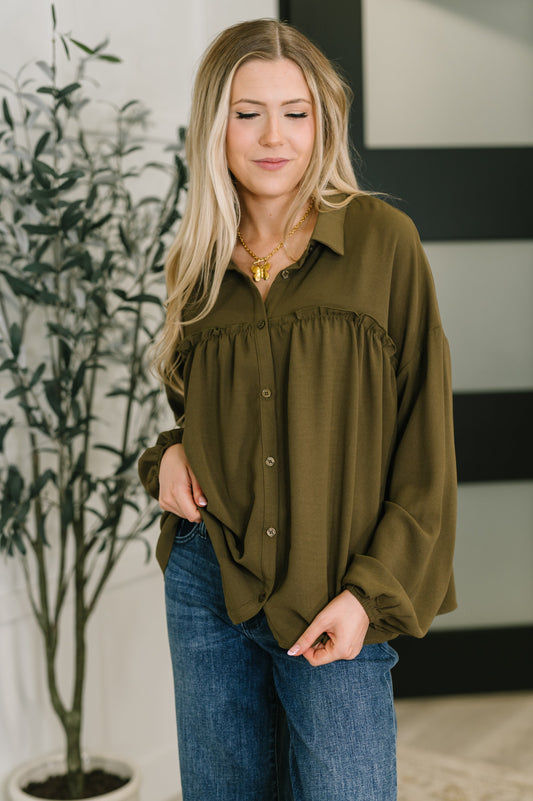 Long sleeve button down top in Olive by Andree by Unit
Woven
No-Stretch
Collared Neckline
Full Front Button Down
Cased Elastic Sleeve Cuff
Gathered, Ruffle Seam Detail
Scooped High-Low Hem
97% Polyester, 3% Spandex
True to Size