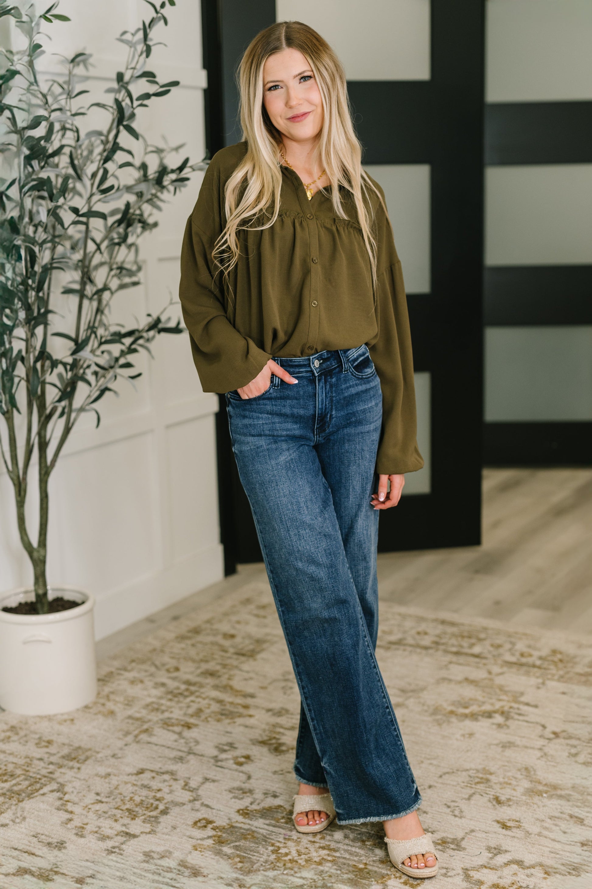 Long sleeve button down top in Olive by Andree by Unit
Woven
No-Stretch
Collared Neckline
Full Front Button Down
Cased Elastic Sleeve Cuff
Gathered, Ruffle Seam Detail
Scooped High-Low Hem
97% Polyester, 3% Spandex
True to Size