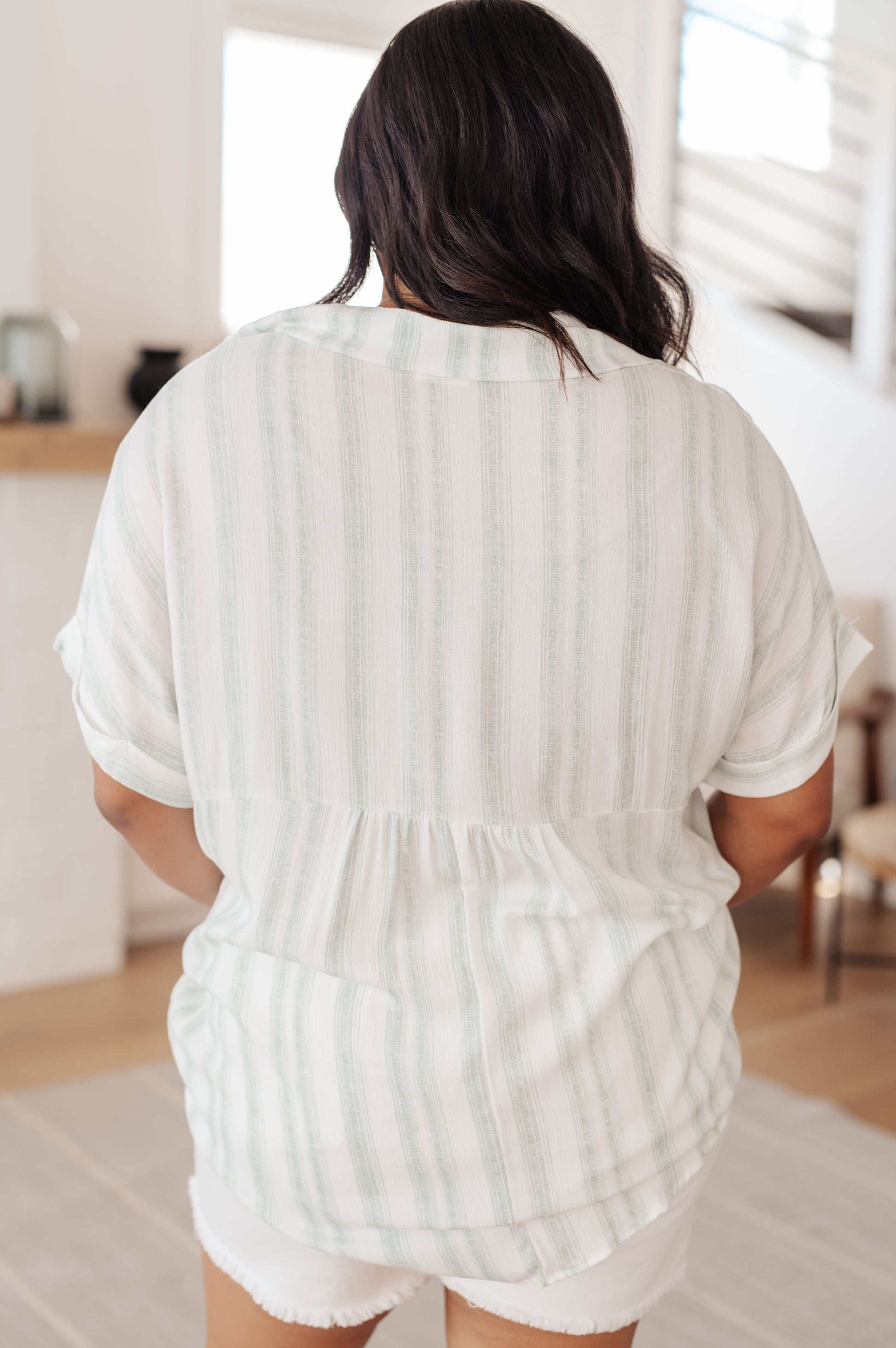 Striped Short Sleeve Top by Lovely Melody
Lightweight Woven
Faux Button Neckline
Fold Over Collar
Cuffed Dolman Sleeve
Gathered Back Seam
Comfort Fit
100% Rayon
True to Size