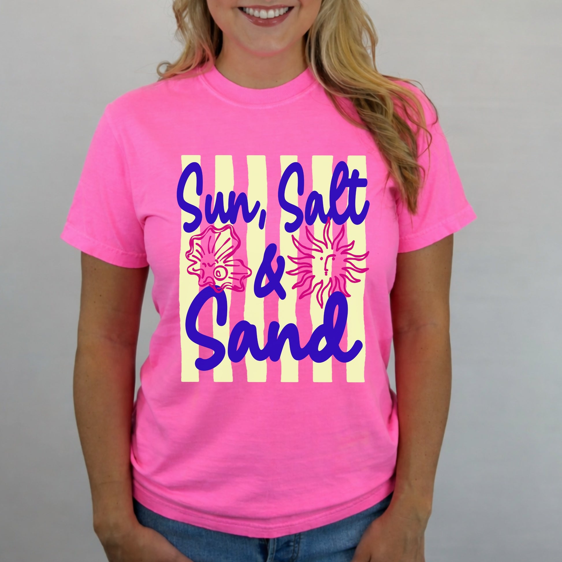 Neon pink Comfort Colors t-shirt with Sun Salt and Sand graphic featuring seashell and sun design for summer beach style