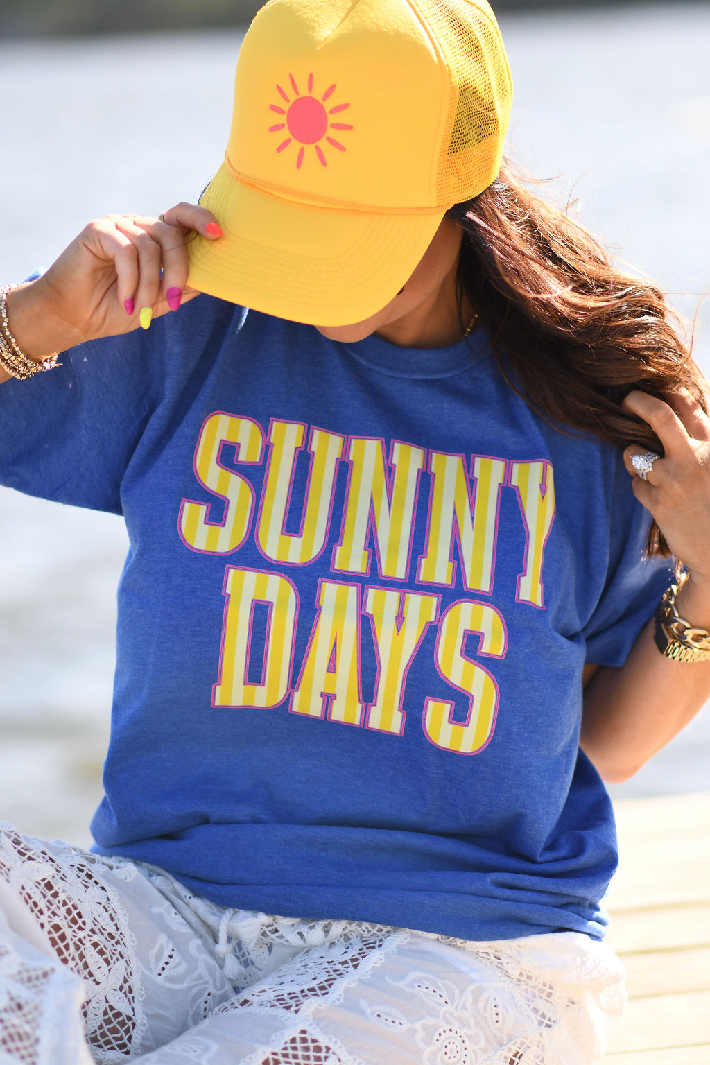 Close-up of Sunny Days colorful graphic print on heather blue Tultex t-shirt with yellow sunshine hat