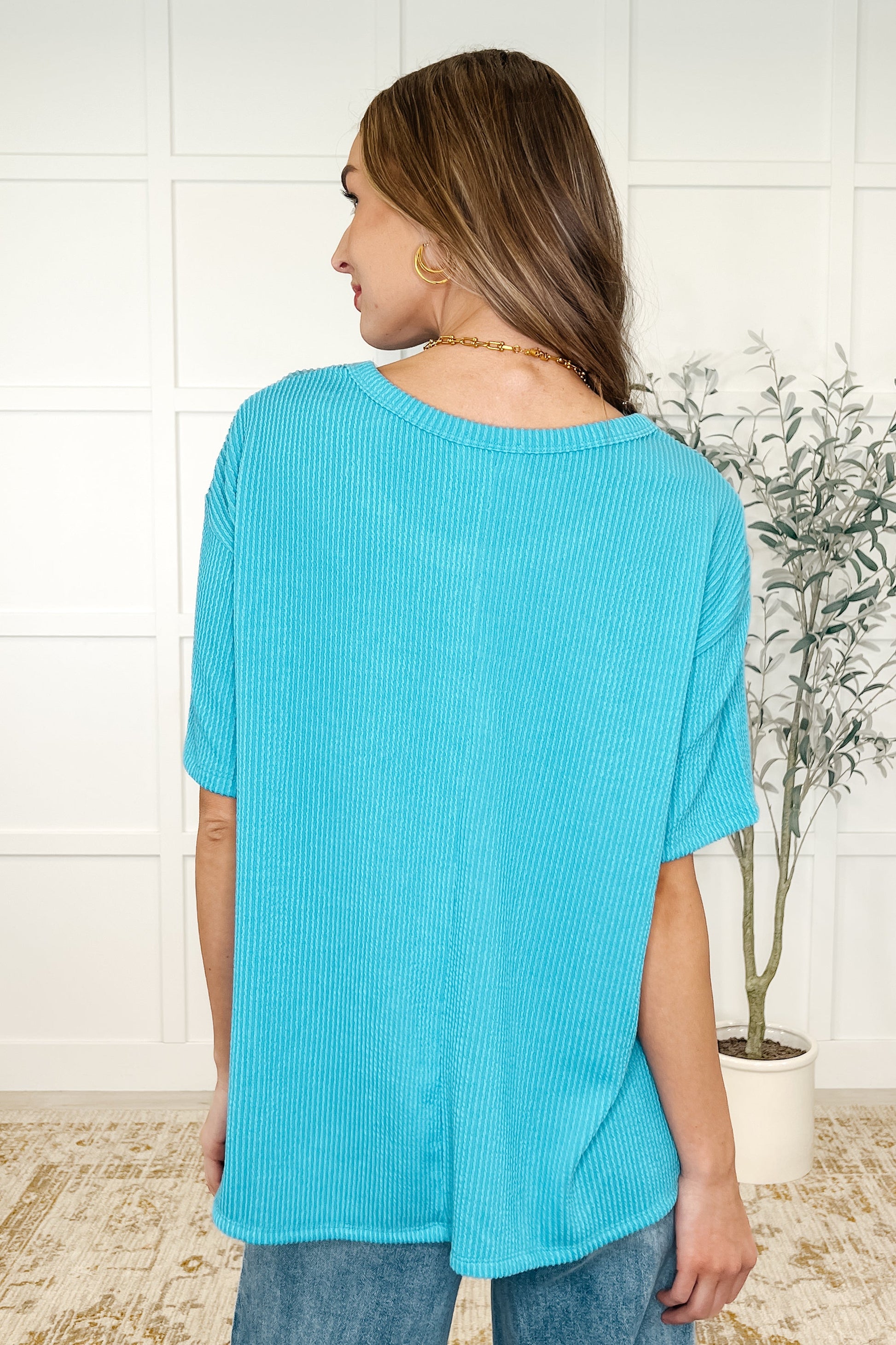 Aqua Glow color, lightweight cable ribbed knit, patch pocket, center back seam top