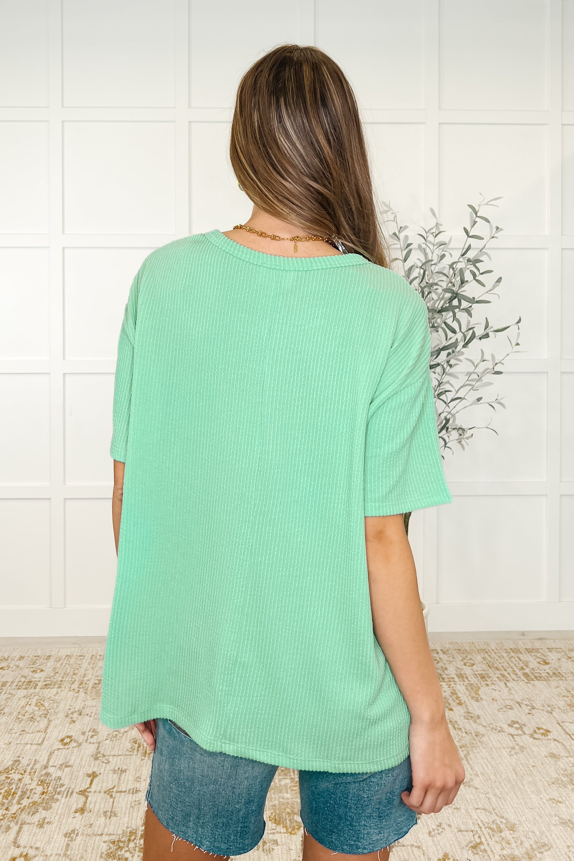 Spearmint color, lightweight cable ribbed knit, patch pocket, center back seam top