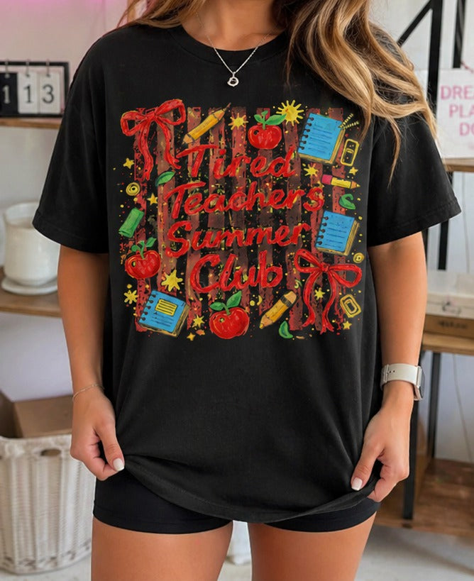 Black funny teacher shirt styled casually with “Tired Teachers Summer Club” print for summer break