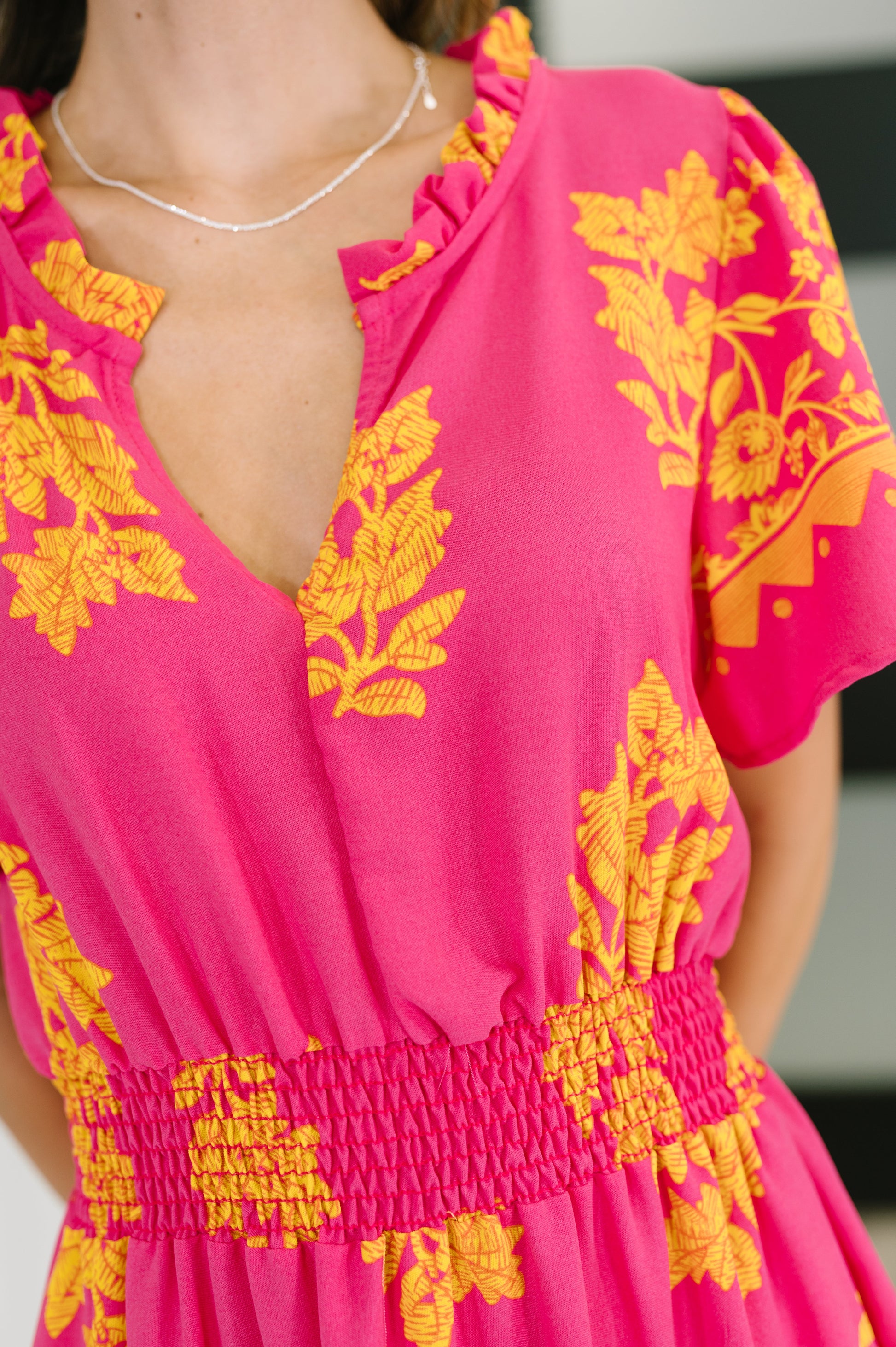 Pink floral, short sleeve dress by Haptics 
Lightweight Woven
No Stretch
V-Neckline
Flutter Sleeve
Smocked Elastic Waistband
Functional Side Pockets
Ruffle Details
Gathered Tiers
100% Polyester
True to Size