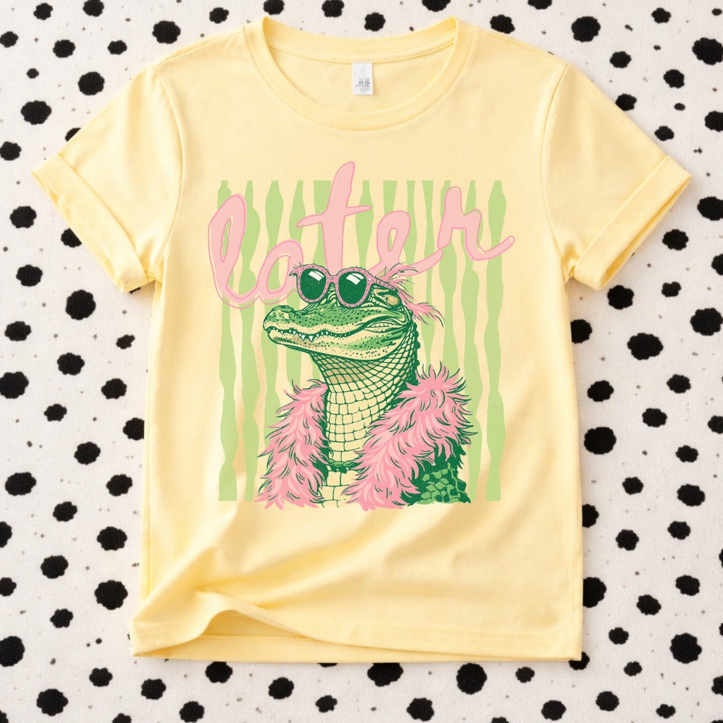 Yellow Boujee Later Gator graphic t-shirt with stylish alligator wearing sunglasses and feather boa, trendy boutique tee