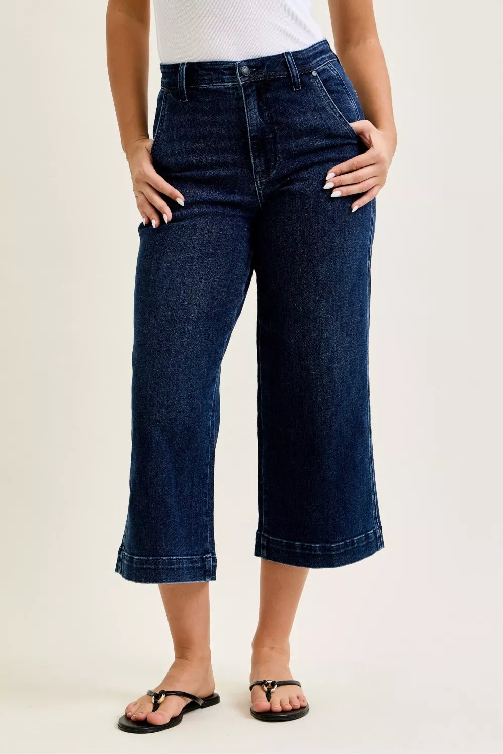 Front view of Judy Blue high waist wide leg crop jeans in dark wash denim on model outdoors