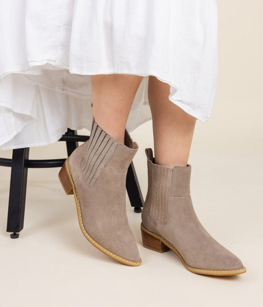 Taupe genuine suede pull on booties by Naughty Monkey. 
